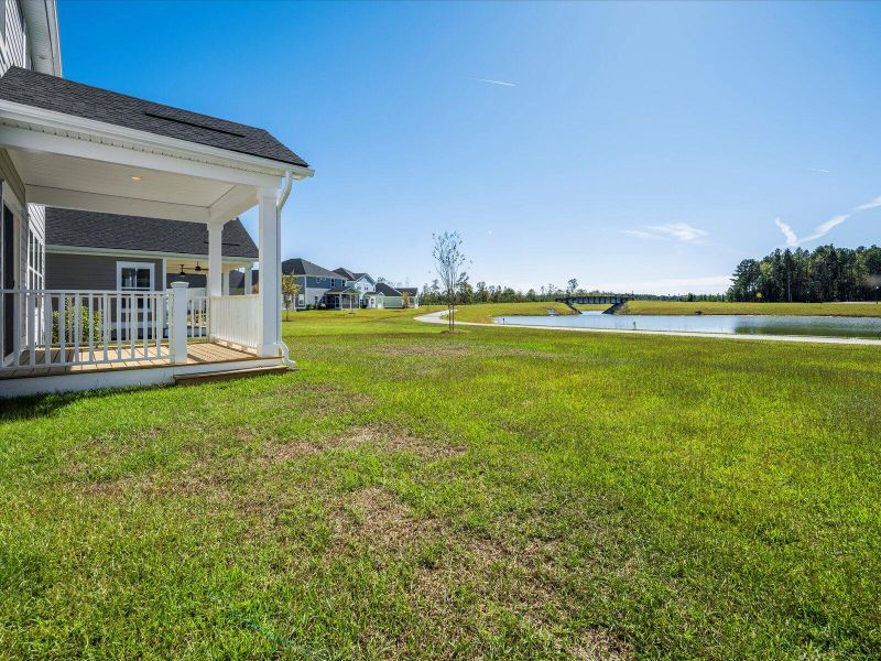 Exterior details and patio area of a home in The Coves at Lakes of Cane Bay II, Summerville (Image 27).
