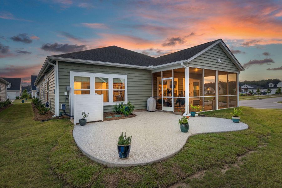 Front exterior of a new home in Horizons at Summers Corner | 55+: The Legends, Summerville, SC, highlighting curb appeal (Image 22).