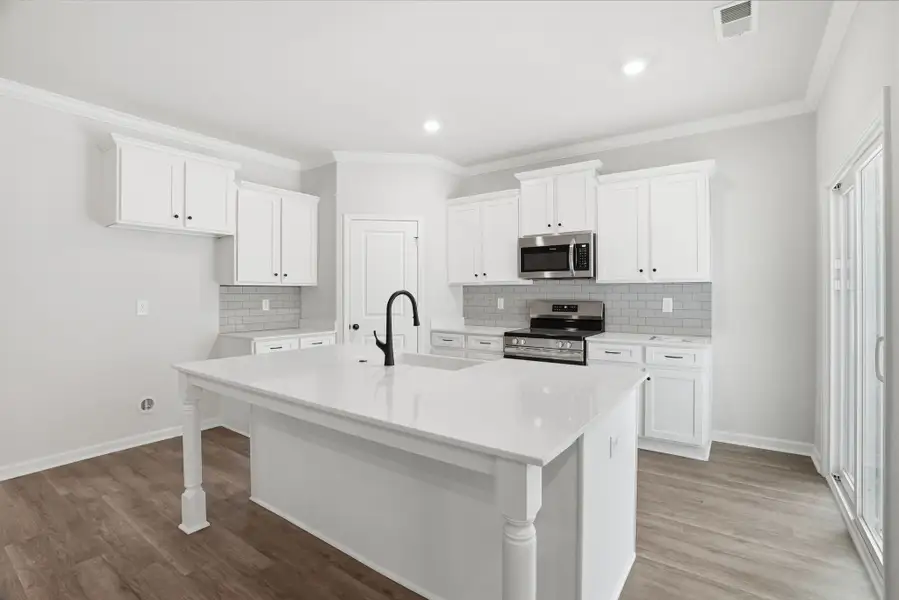 Representative furnished interior of a home built from the Magnolia Select M by McGuinn Homes in Broadway Lake, Anderson (Image 6).