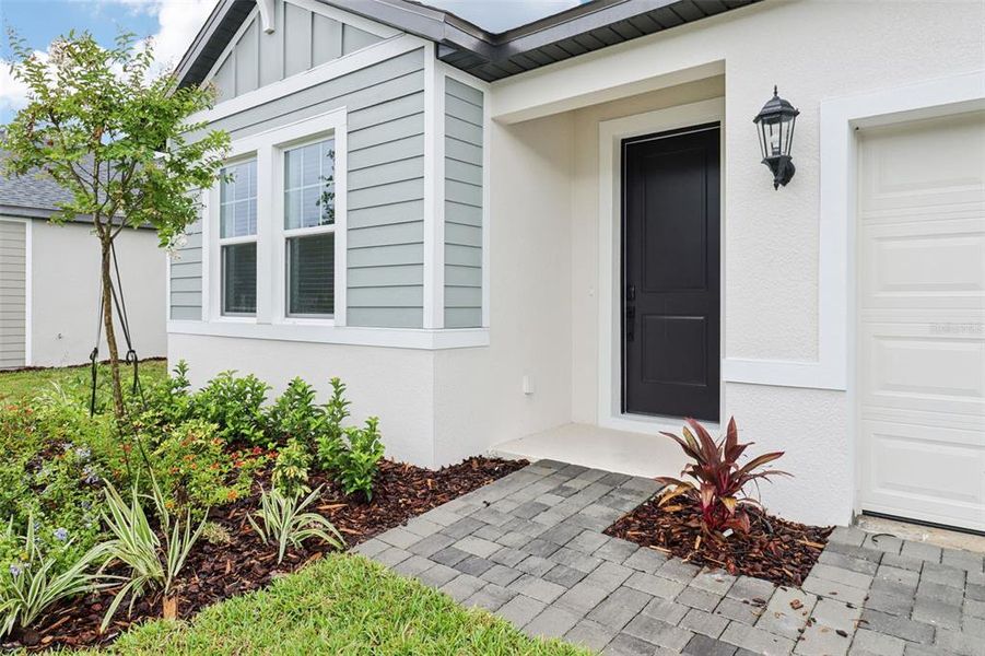 Exterior details and patio area of a home in Ridgehaven - Reserve Series, Ormond Beach (Image 24).