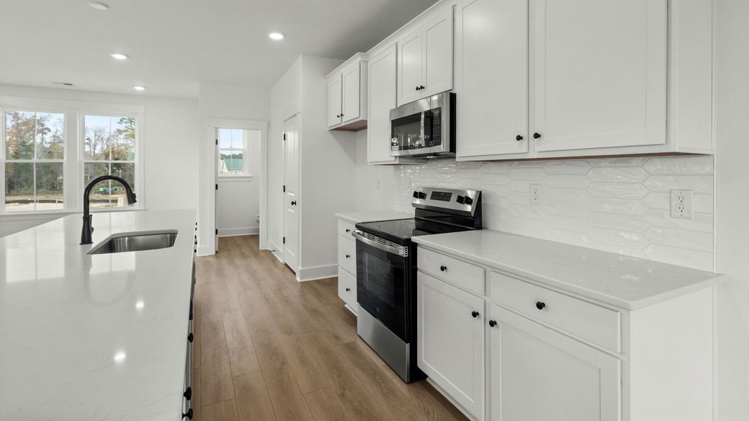 Furnished interior view inside a new home in Seabreeze Crossing, Little River (Image 12).