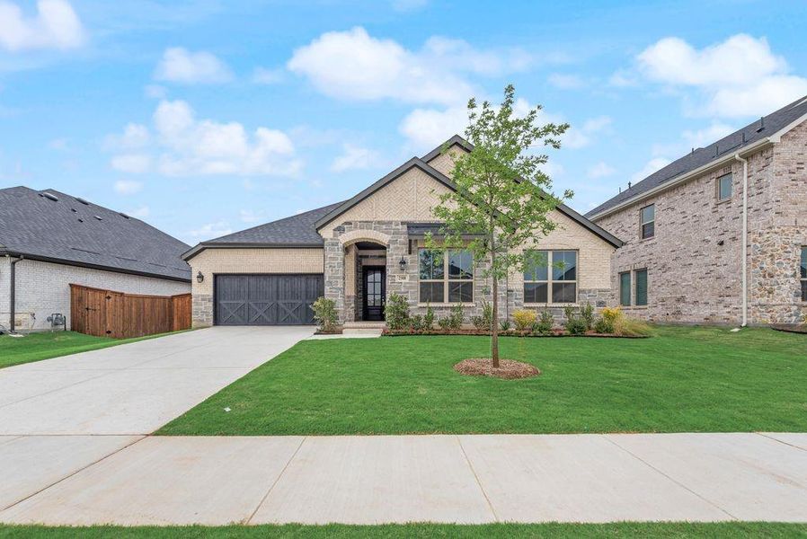 Front exterior of a new home in Valencia On The Lake, Little Elm, TX, highlighting curb appeal (Image 20).
