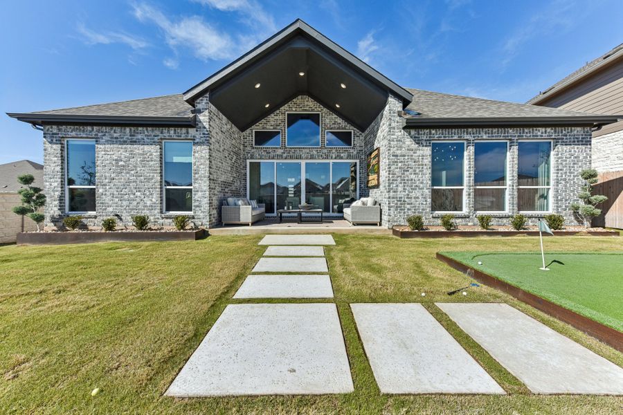 Front exterior of a new home in The Grove at Blackhawk, Pflugerville, TX, highlighting curb appeal (Image 29).