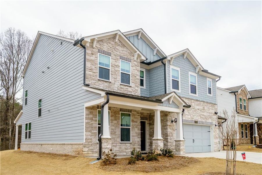 Front exterior of a new home in , Powder Springs, GA, highlighting curb appeal (Image 34). Front exterior of a new home in , Powder Springs, GA, highlighting curb appeal (Image 34).