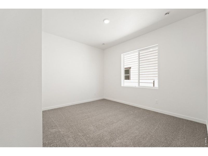 Spacious, unfurnished interior of a new home in Union Colony West, Greeley (Image 20).