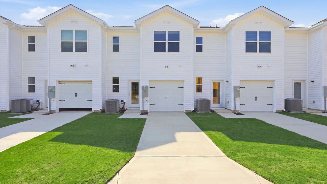 Front exterior of a new home in Clock Road Townhomes, New Bern, NC, highlighting curb appeal (Image 21).