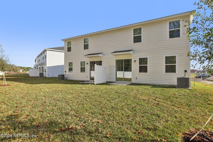 Exterior details and patio area of a home in Cypress Meadows - The Villas, Jacksonville (Image 25).