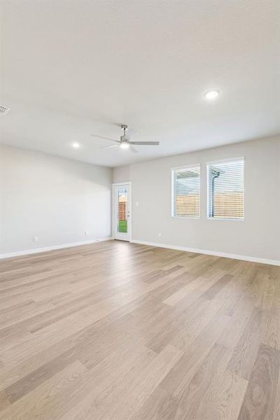 Living Room in the Haylee home plan by Trophy Signature Homes - REPRESENTATIVE PHOTO