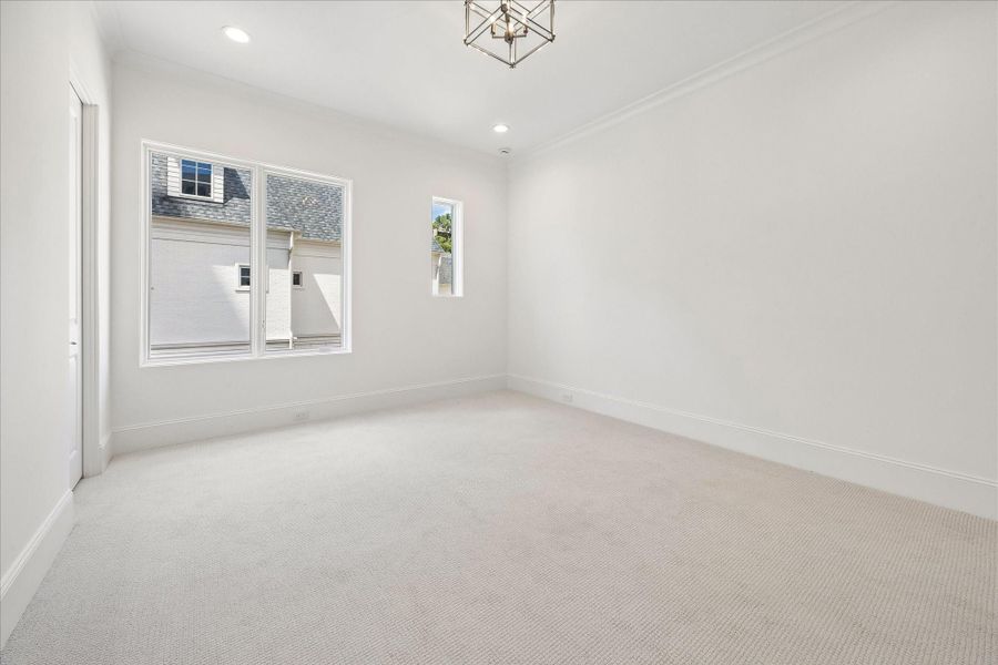 The final second-floor bedrooms features high-performance carpet, en-suite bathroom, and spacious walk-in closet.