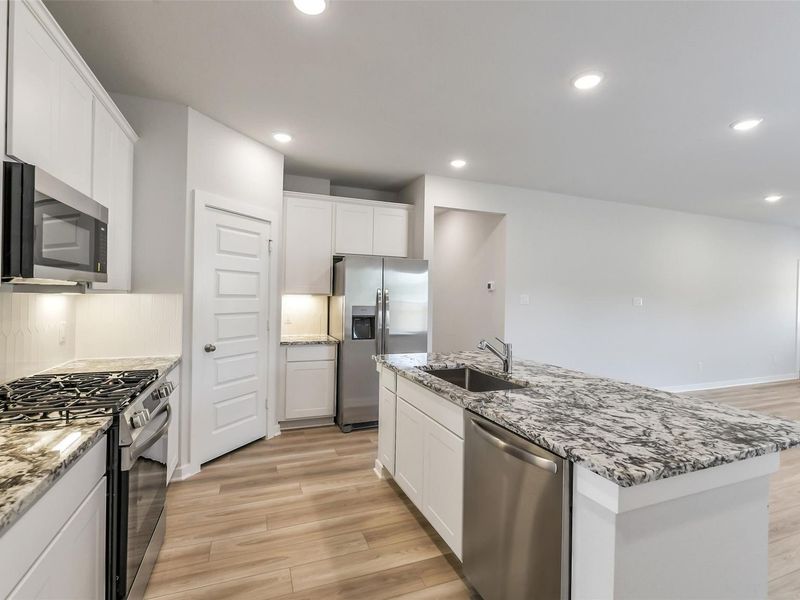 Furnished interior view inside a new home in Caney Creek Place, Conroe (Image 7).