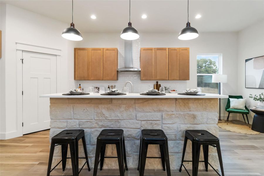 Stone accent island with granite countertops Stone accent island with granite countertops