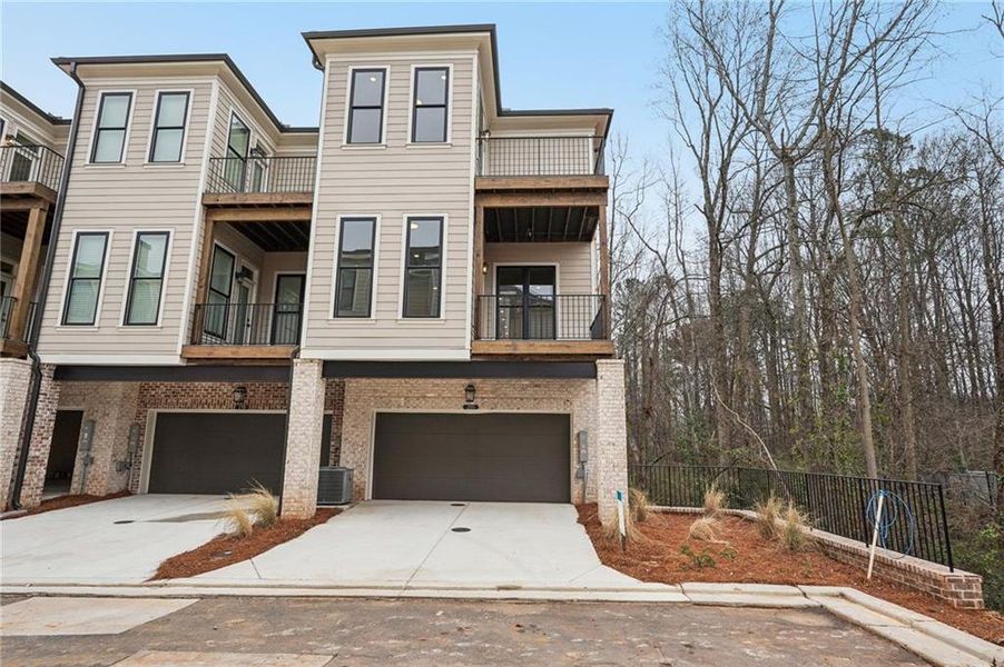 Front exterior of a new home in Byers Park, Alpharetta, GA, highlighting curb appeal (Image 23).