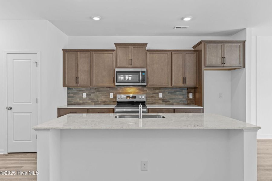 Furnished interior view inside a new home in Coastal Haven Townes, Leland (Image 7).