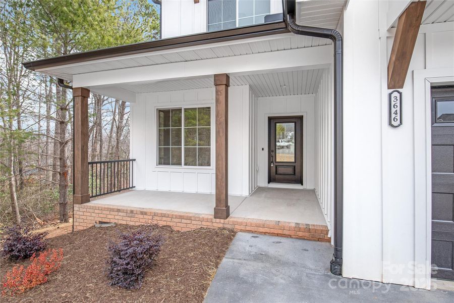 Front exterior of a new home in , Hickory, NC, highlighting curb appeal (Image 23).