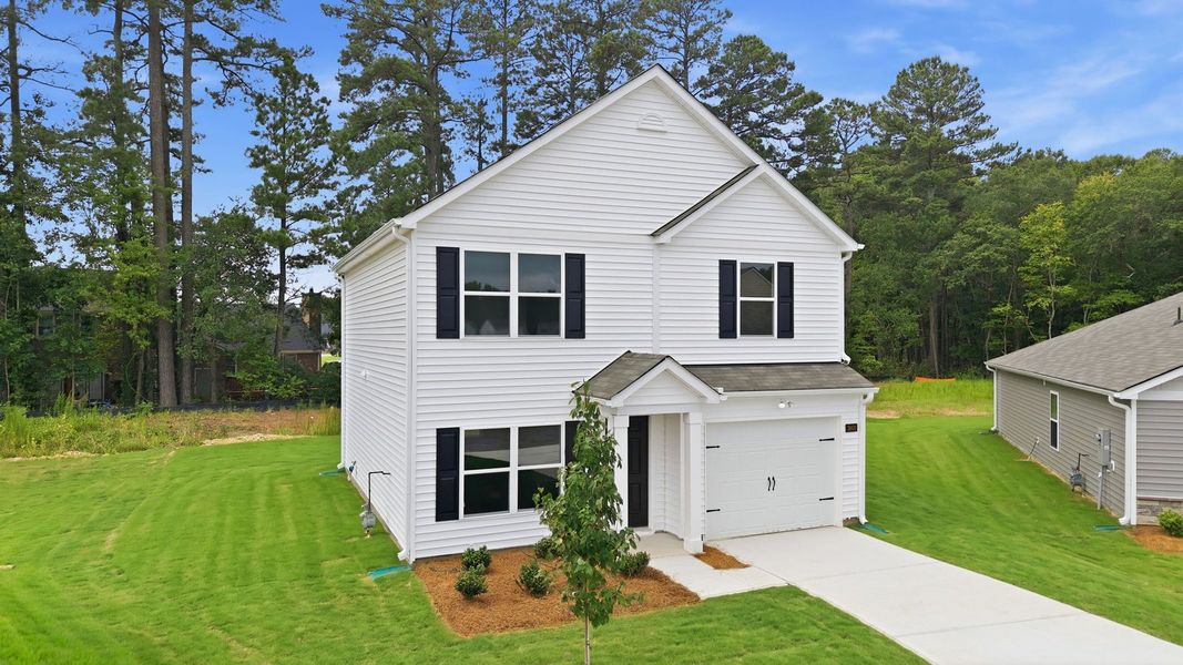 Front exterior of a new home in Jetstream Park, Wilson, NC, highlighting curb appeal (Image 2). Front exterior of a new home in Jetstream Park, Wilson, NC, highlighting curb appeal (Image 2).