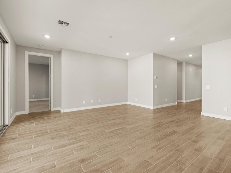 Spacious, unfurnished interior of a new home in White Tank Foothills Signature Series, Waddell (Image 10).