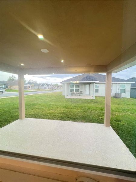Exterior details and patio area of a home in Abbey Glen, Dade City (Image 3).