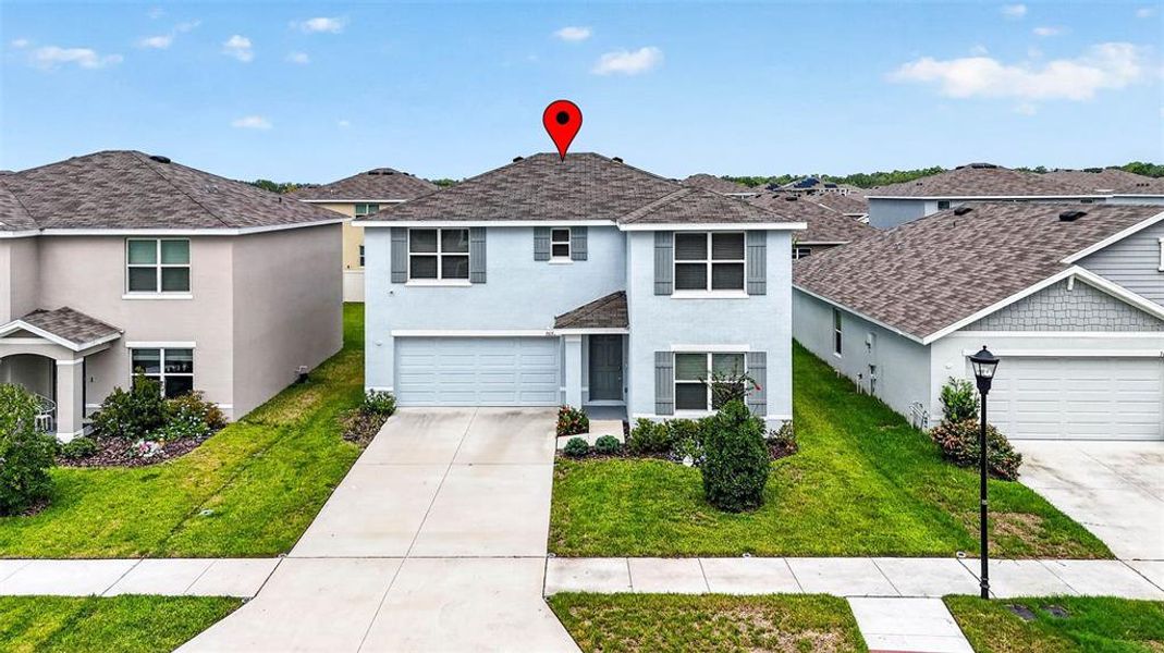 Front exterior of a new home in , Tampa, FL, highlighting curb appeal (Image 25).