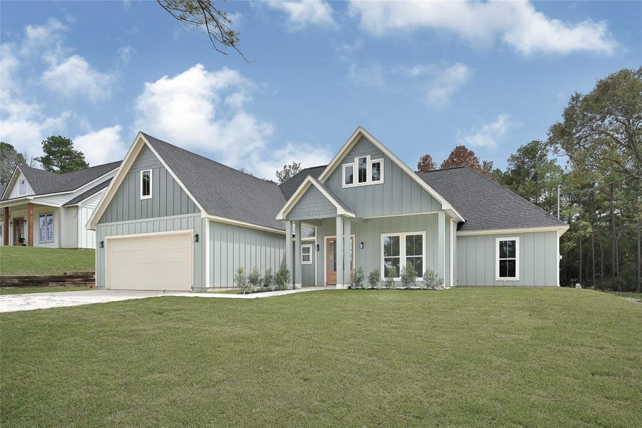 Front exterior of a new home in , Plantersville, TX, highlighting curb appeal (Image 2).