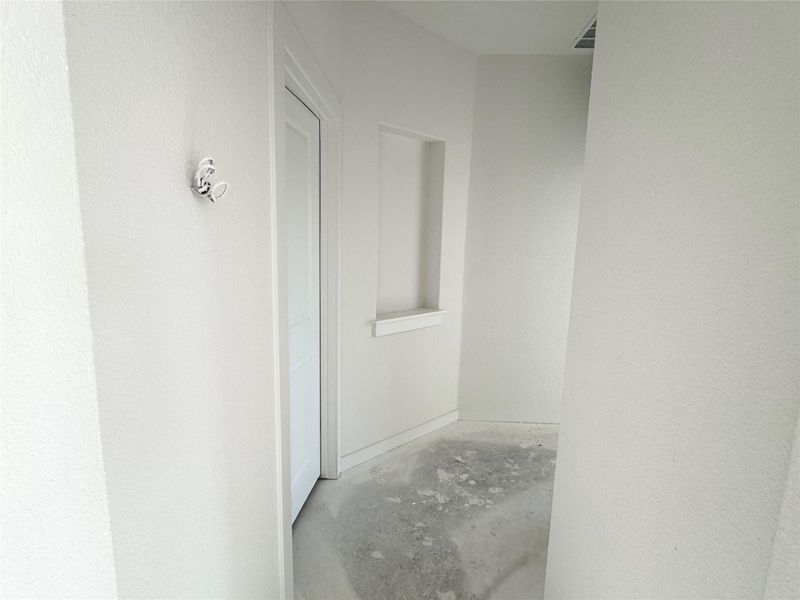 Hall featuring concrete floors