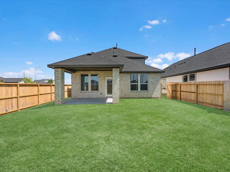 Exterior details and patio area of a home in Mason Woods, Cypress (Image 3).