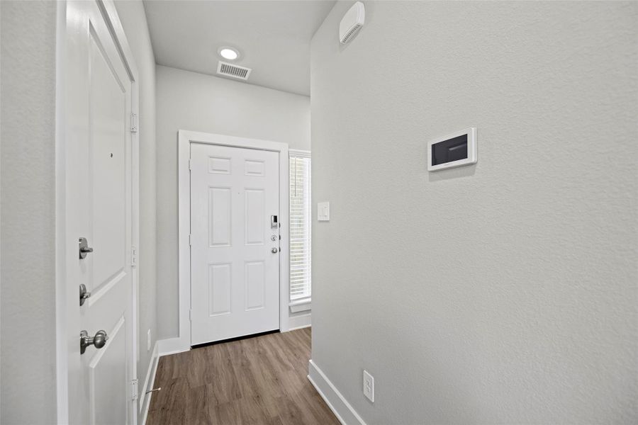 Thoughtful architectural touches add warmth and sophistication right from the moment you step inside.