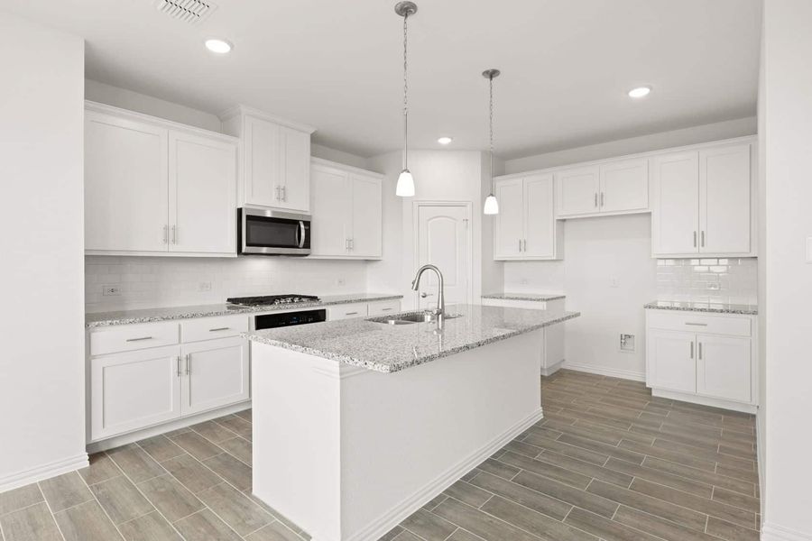 Representative furnished interior of a home built from the Blackburn by UnionMain Homes in Reunion, Rhome (Image 6).