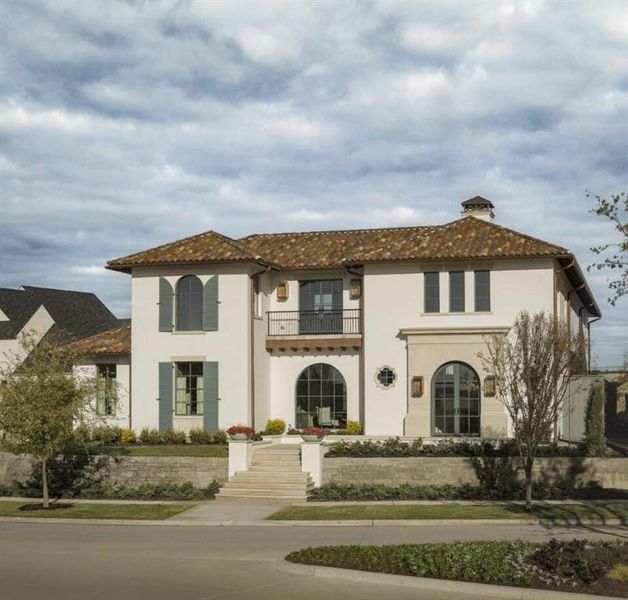 View of front facade with a balcony, stucco siding, a chimney, and a tile roof View of front facade with a balcony, stucco siding, a chimney, and a tile roof