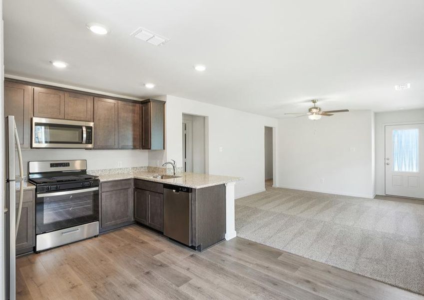 The kitchen has sprawling granite countertops.