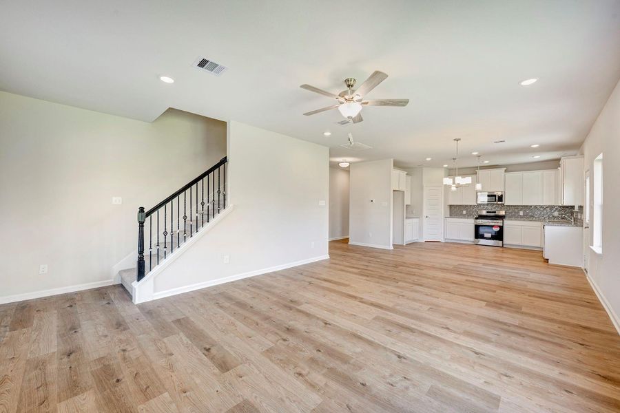 The McGinnis- Family Room into the Dining Area and Kitchen The McGinnis- Family Room into the Dining Area and Kitchen