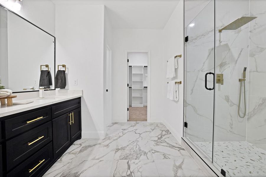 Bathroom featuring vanity and walk in shower