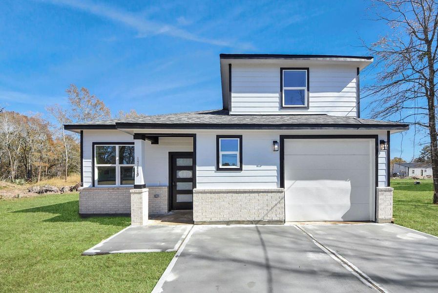 Front exterior of a new home in , Conroe, TX, highlighting curb appeal (Image 17).
