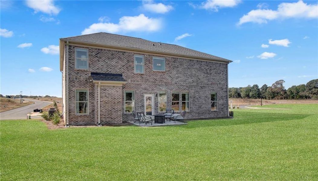 Front exterior of a new home in Adagio, Dacula, GA, highlighting curb appeal (Image 2).