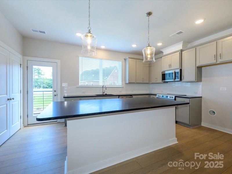 Furnished interior view inside a new home in Central Living at Craig, Charlotte (Image 4).
