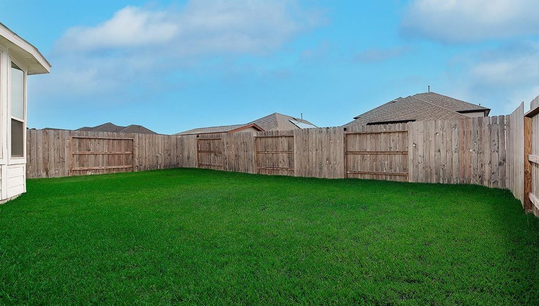 Front exterior of a new home in Mavera, Conroe, TX, highlighting curb appeal (Image 2).