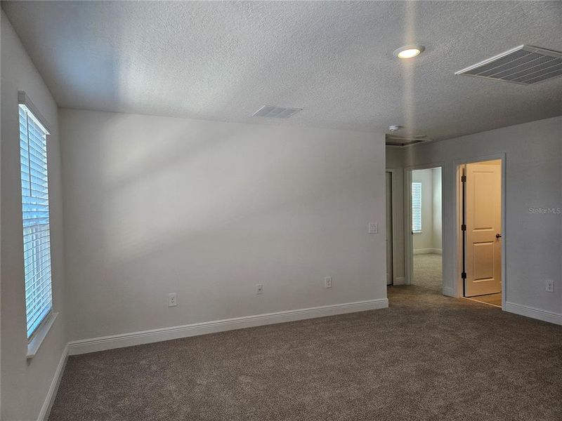 Spacious, unfurnished interior of a new home in The Reserve at Hammock Oaks - Classic Series, Lady Lake (Image 29).