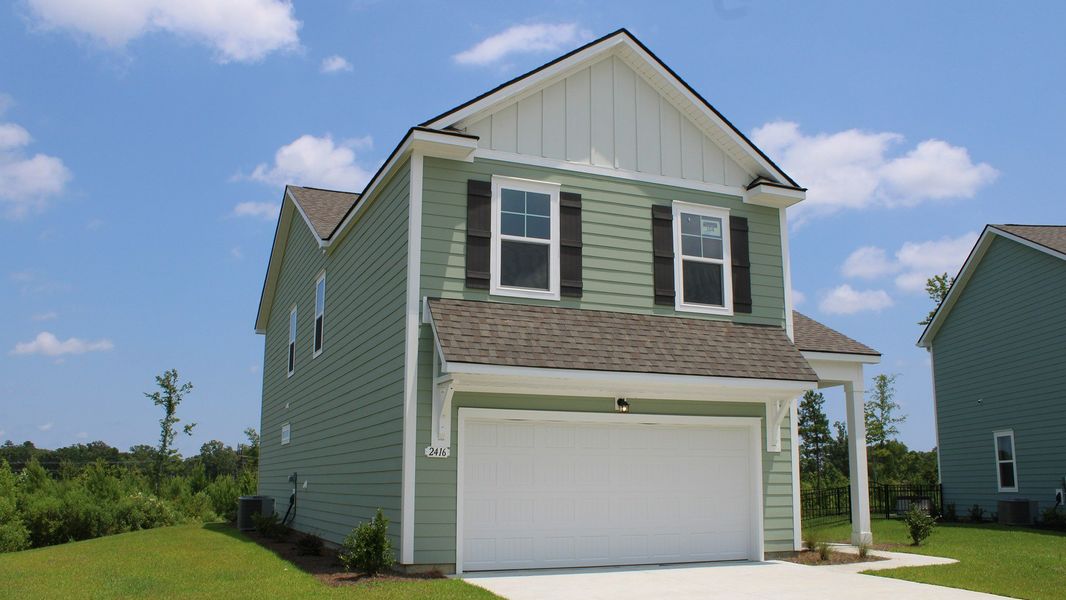 Front exterior of a new home in Auberon Woods, Conway, SC, highlighting curb appeal (Image 2).