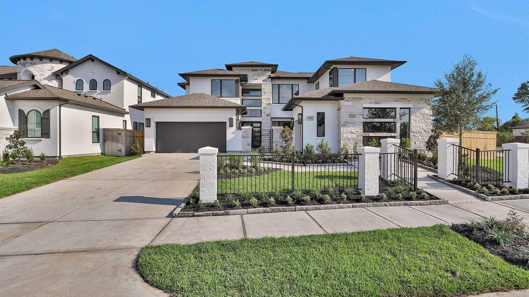 Front exterior of a new home in Sienna 65' - Valencia, Missouri City, TX, highlighting curb appeal (Image 1).