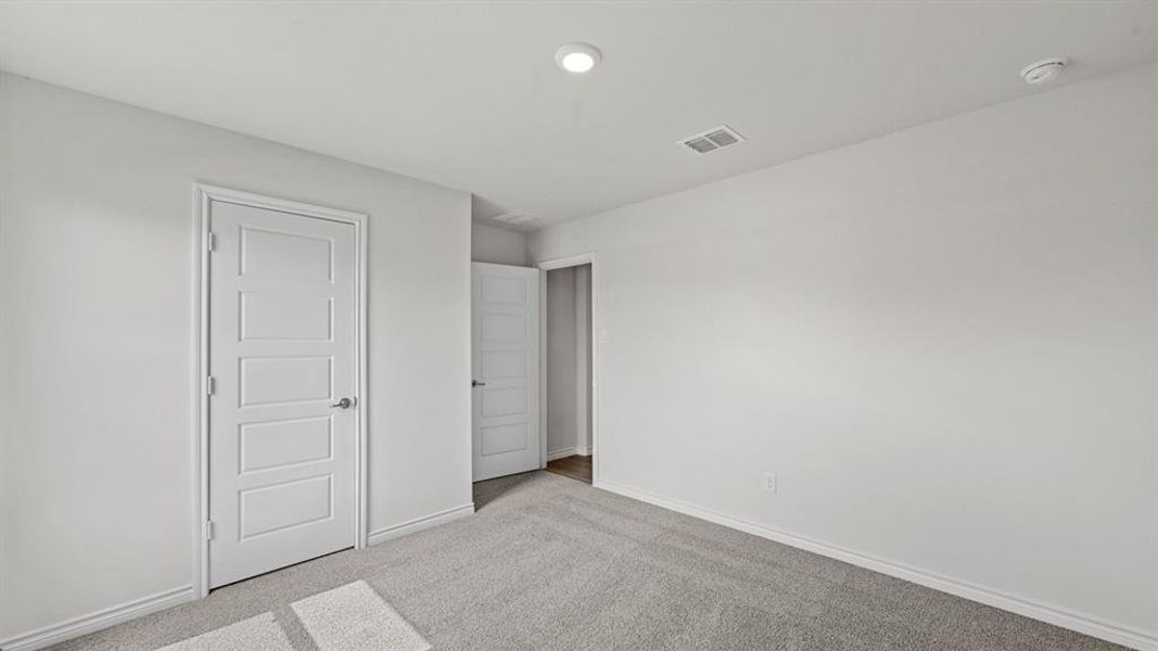 Neutral tone wall color with light grey carpet flooring Neutral tone wall color with light grey carpet flooring
