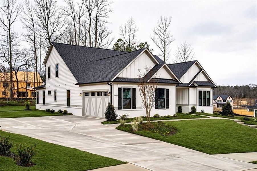 Front exterior of a new home in , Cumming, GA, highlighting curb appeal (Image 27).