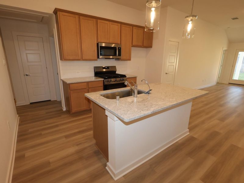 Furnished interior view inside a new home in Pinewood at Grand Texas, New Caney (Image 10).