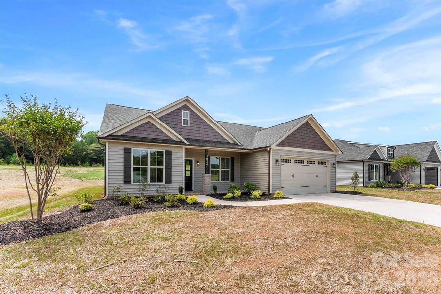 Front exterior of a new home in , Albemarle, NC, highlighting curb appeal (Image 26).