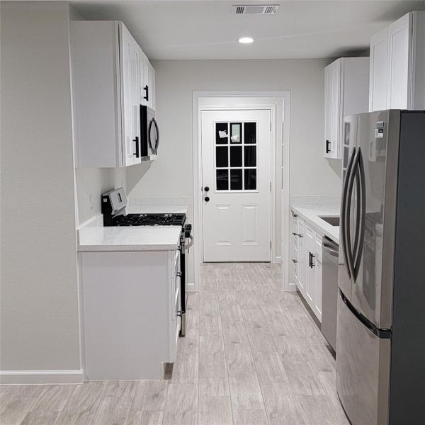 KITCHEN VIEW FROM DINING AREA- MODEL HOME 114