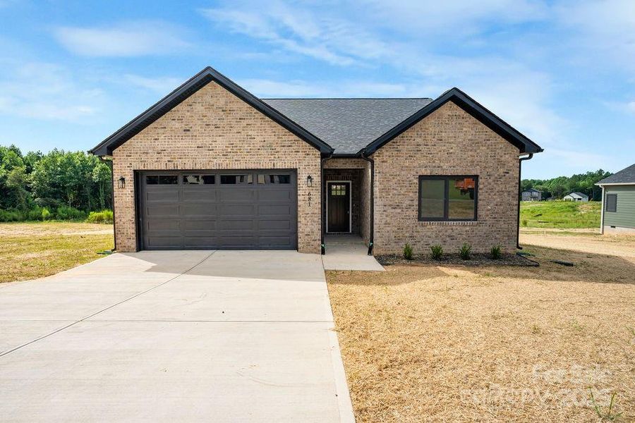 Front exterior of a new home in , Lincolnton, NC, highlighting curb appeal (Image 12).