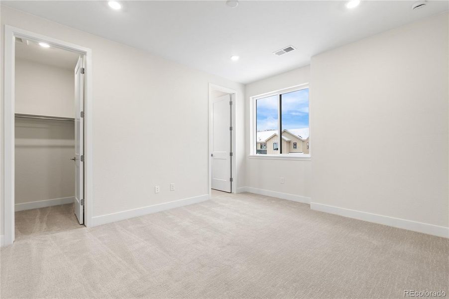 Spacious, unfurnished interior of a new home in Autograph at Lyric, Lone Tree (Image 22).