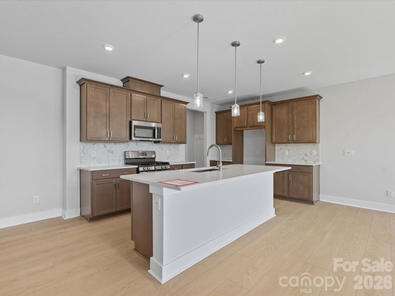 Large island with single bowl stainless steel sink