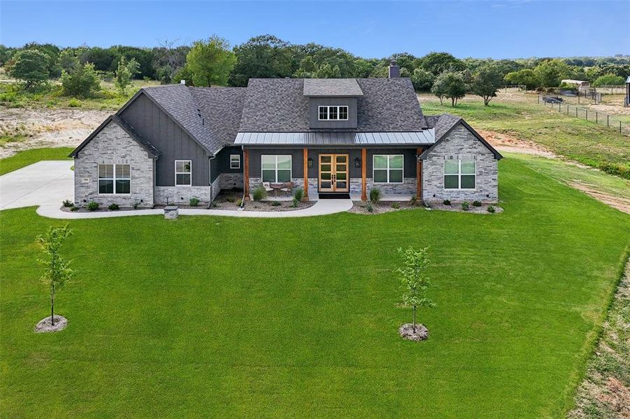 Front exterior of a new home in , Weatherford, TX, highlighting curb appeal (Image 21).