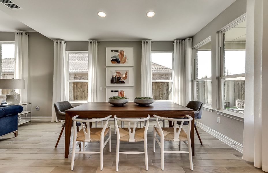 Spacious dining area with recessed lighting