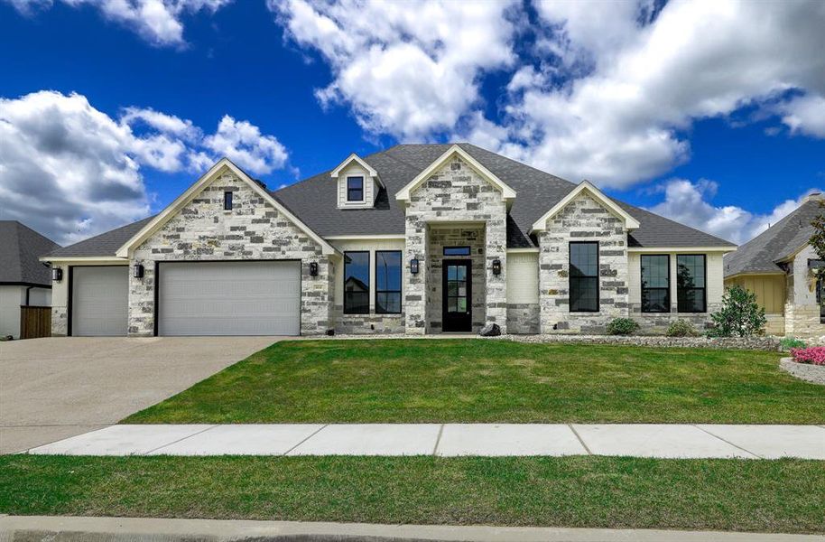 Front exterior of a new home in Whitestone Heights, Benbrook, TX, highlighting curb appeal (Image 1). Front exterior of a new home in Whitestone Heights, Benbrook, TX, highlighting curb appeal (Image 1).