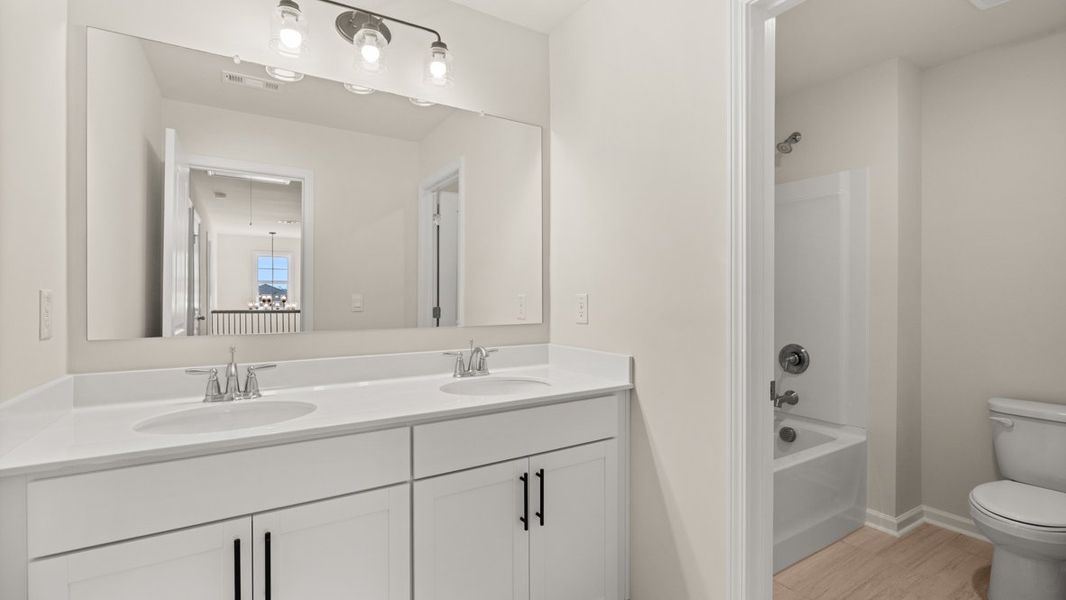 Representative furnished interior of a home built from the WINDSOR by D.R. Horton in Butner Estates, South Fulton (Image 37).